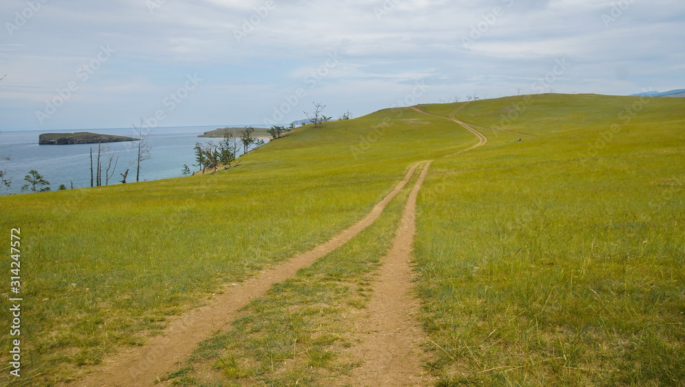Obraz premium landscape with a view of the outgoing road along the green coast