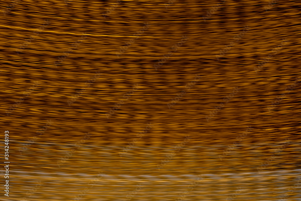 Obraz premium Defocused of blurred lush lava orange speed line light in the dark night for abstract background texture patterns