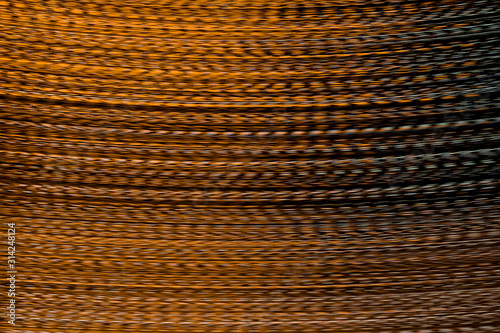 Defocused of blurred lush lava orange speed line light in the dark night for abstract background texture patterns