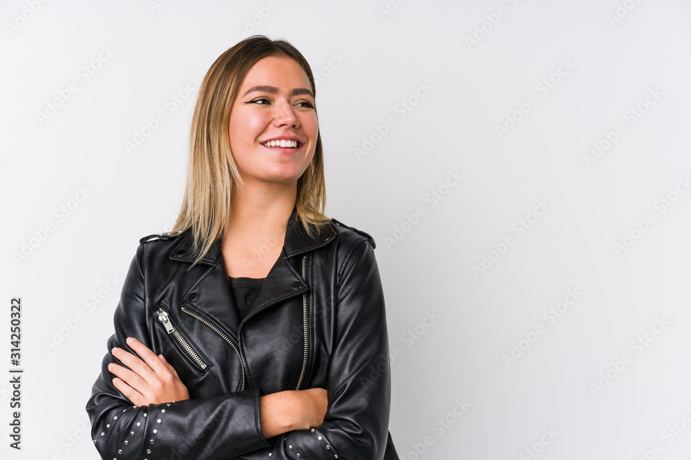 Young caucasian woman wearing a black leather jacket smiling confident with crossed arms. Young caucasian woman wearing a black leather jacket smiling confident with crossed arms.