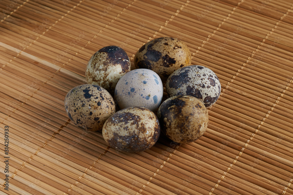 quail eggs close-up on a black background