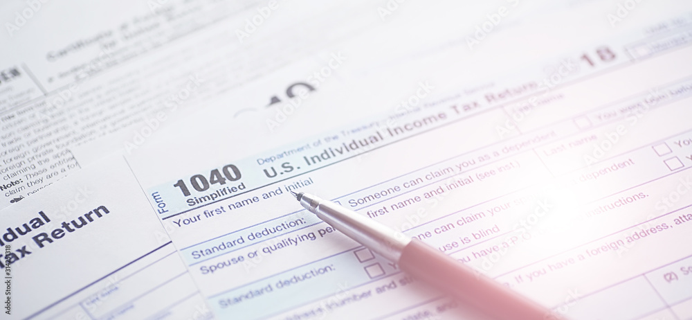 Annual tax reporting. Tax form on the table. Financial statements for signature. Annual tax reporting. Tax form on the table. Financial statements for signature.