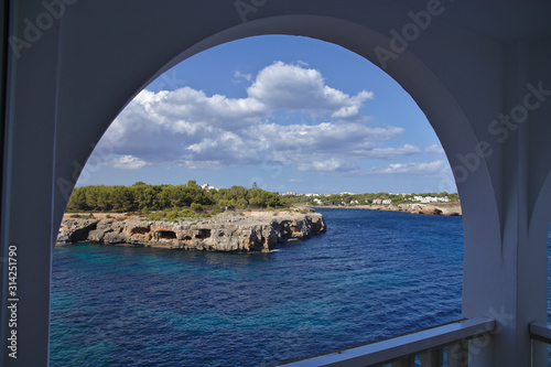 Ocean view from a balcony through a round arch