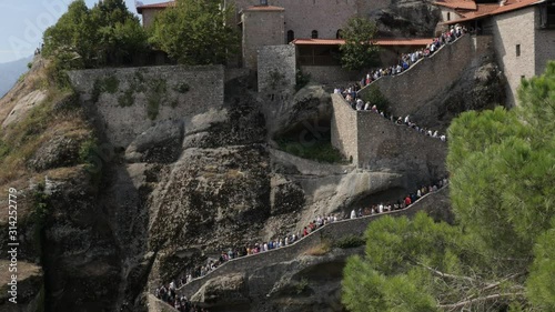Holy Monastery of Great Meteoron with lot of tourists climbing up the stairways 4K video