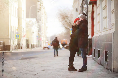 Young couple walking through the winter