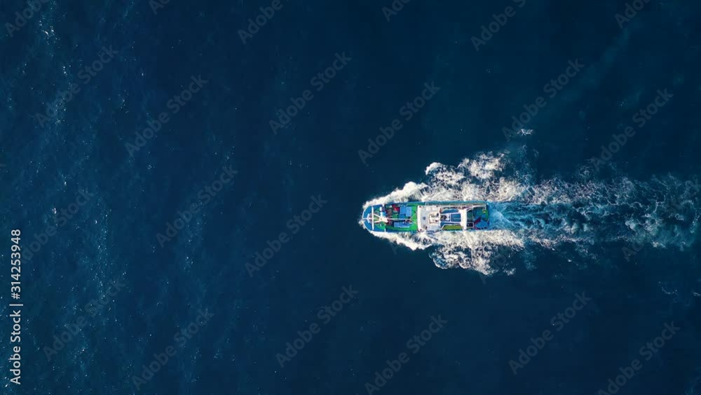 Top view of a fishing boat sailing in the Atlantic Ocean
