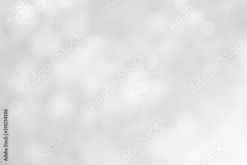 Gray and white nature blurred color glow colorful light sparkling summer. Valentine's day blurry concept. Abstract white bokeh texture with soft foreground bubble shiny in grey vintage style bright.