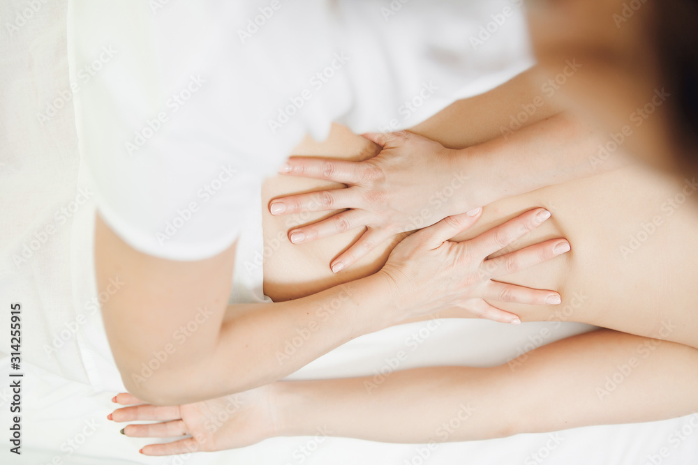 Young woman relaxing with hand professional back massage beauty spa