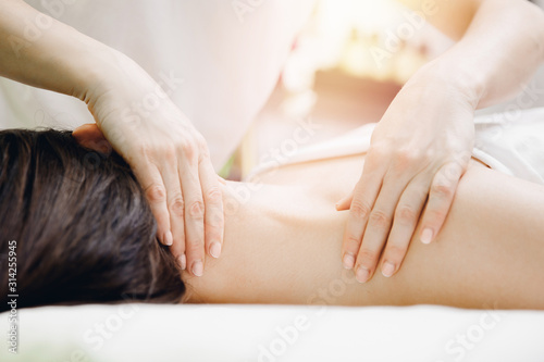 Massage professional of neck for sport woman in salon beauty spa