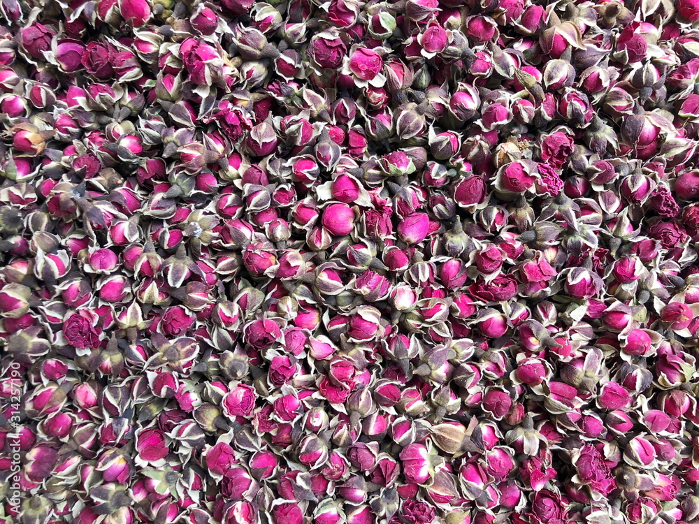 Dried small rosebuds for herbal tea. Pink colored dry roses.