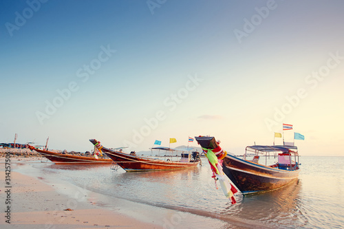 Traveling by Thailand. Beautiful landscape with traditional fishing long tail boats on the beach.