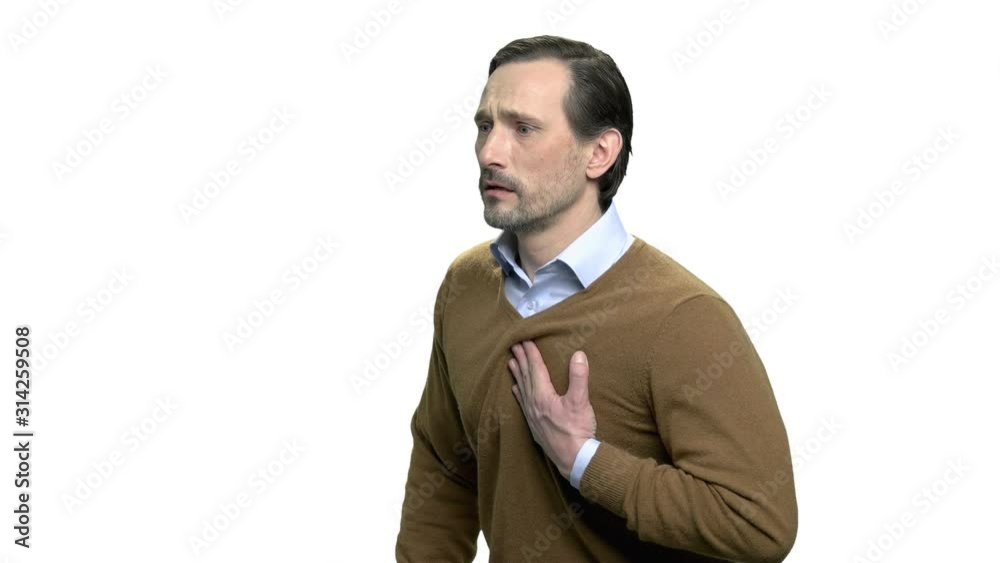 Portrait of mature man with sudden heart-attack. Side view caucasian man suffering from heart ache. Isolated on white background. Portrait of mature man with sudden heart-attack. Side view caucasian man suffering from heart ache. Isolated on white background.