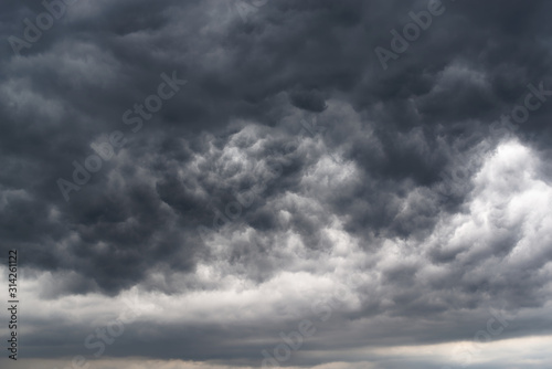 Fototapeta Naklejka Na Ścianę i Meble -  Low angle view of dramatic sky and dark stormy clouds