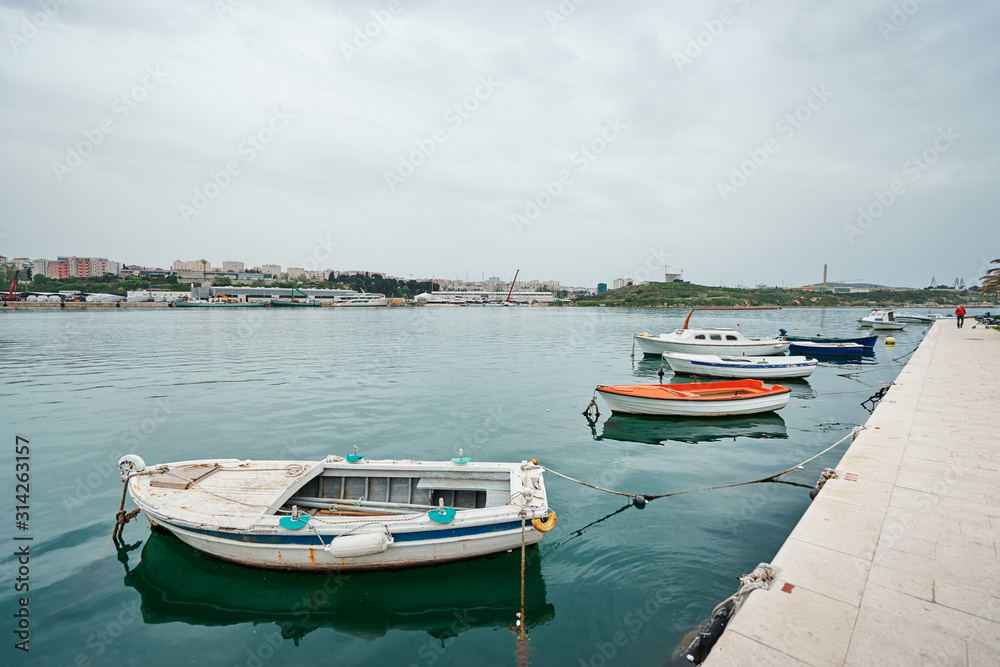 Harbor with leisure and fishing boats at anchor,