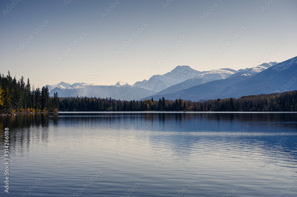 Canadian rockies with autumn forest and clear sky on Pyramid lake in Jasper national park