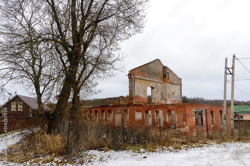 Abandoned ruined house on the outskirts of the village, empty windows Abandoned ruined house on the outskirts of the village, empty windows