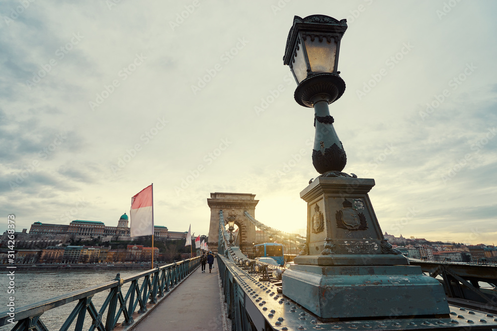 Chain bridge at sunset time on Danube river in Budapest city, Hungary.