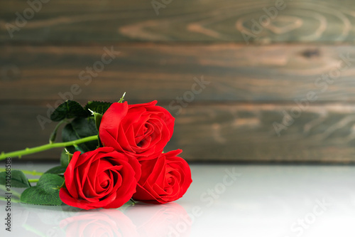 Red roses on table with copy space