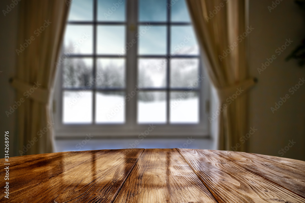 Desk of free space and blurred winter window background. Desk of free space and blurred winter window background.