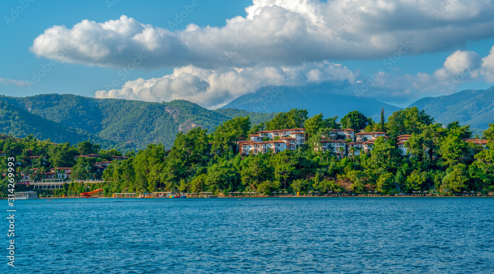 Green island, sea and mountains landscape. Summer holidays concept. Tourism background. High detailed photo