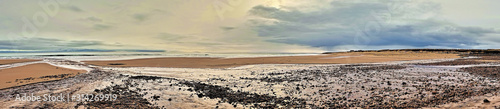 Brora beach at the first burn with the tide out looking south towards Brora