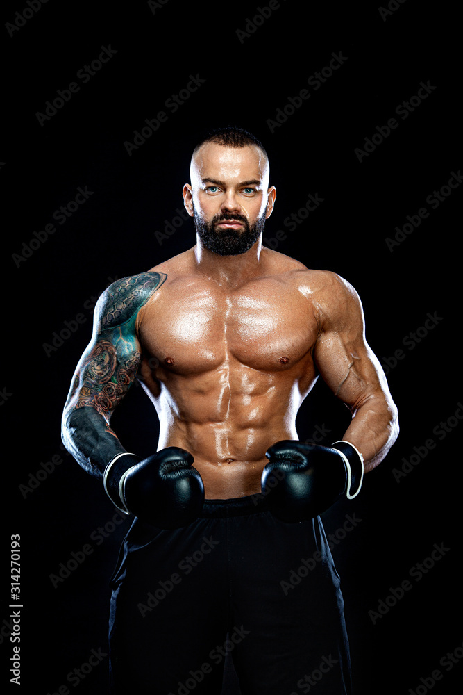 Fitness and boxing concept. Boxer, man fighting or posing in gloves on black background. Individual sports recreation. Fitness and boxing concept. Boxer, man fighting or posing in gloves on black background. Individual sports recreation.