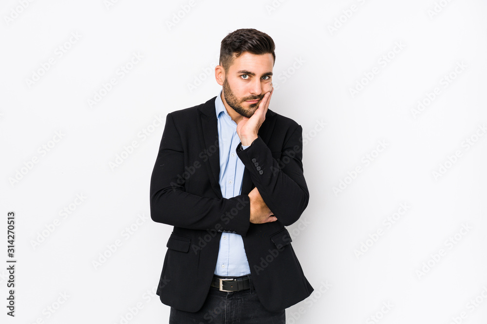 Young caucasian business man against a white background isolated who is bored, fatigued and need a relax day. Young caucasian business man against a white background isolated who is bored, fatigued and need a relax day.