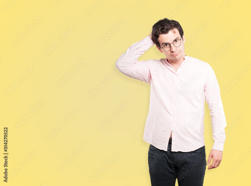 Depressed young man doing a gesture of stress Depressed young man doing a gesture of stress
