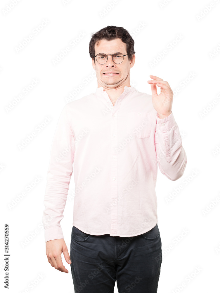 Concerned young man with a gesture of disgust Concerned young man with a gesture of disgust