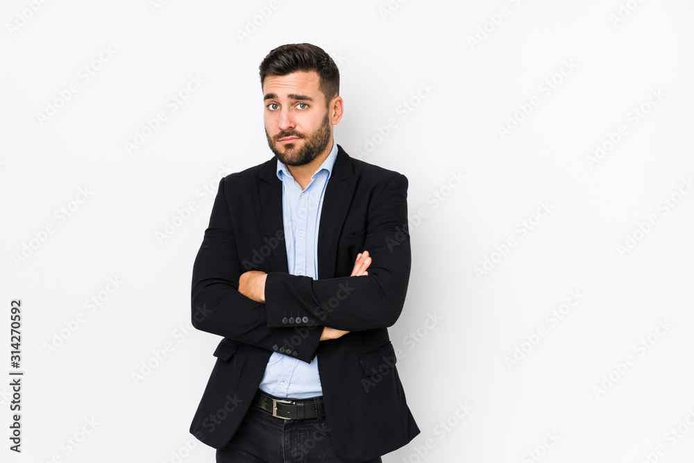 Young caucasian business man against a white background isolated unhappy looking in camera with sarcastic expression. Young caucasian business man against a white background isolated unhappy looking in camera with sarcastic expression.