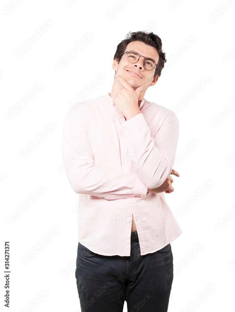 Happy young man making a gesture of doubt