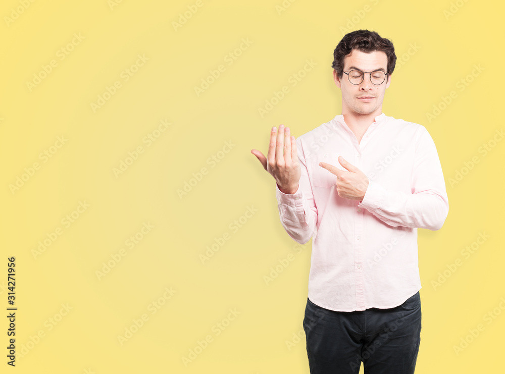 Friendly young man making a gesture of welcome Friendly young man making a gesture of welcome
