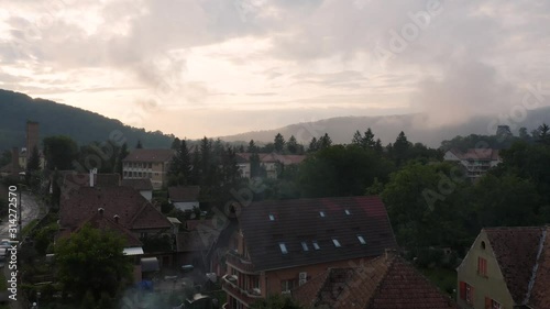 4k Sighisoara Drone Footage Rising Over Ancient Europe Town Sunset photo