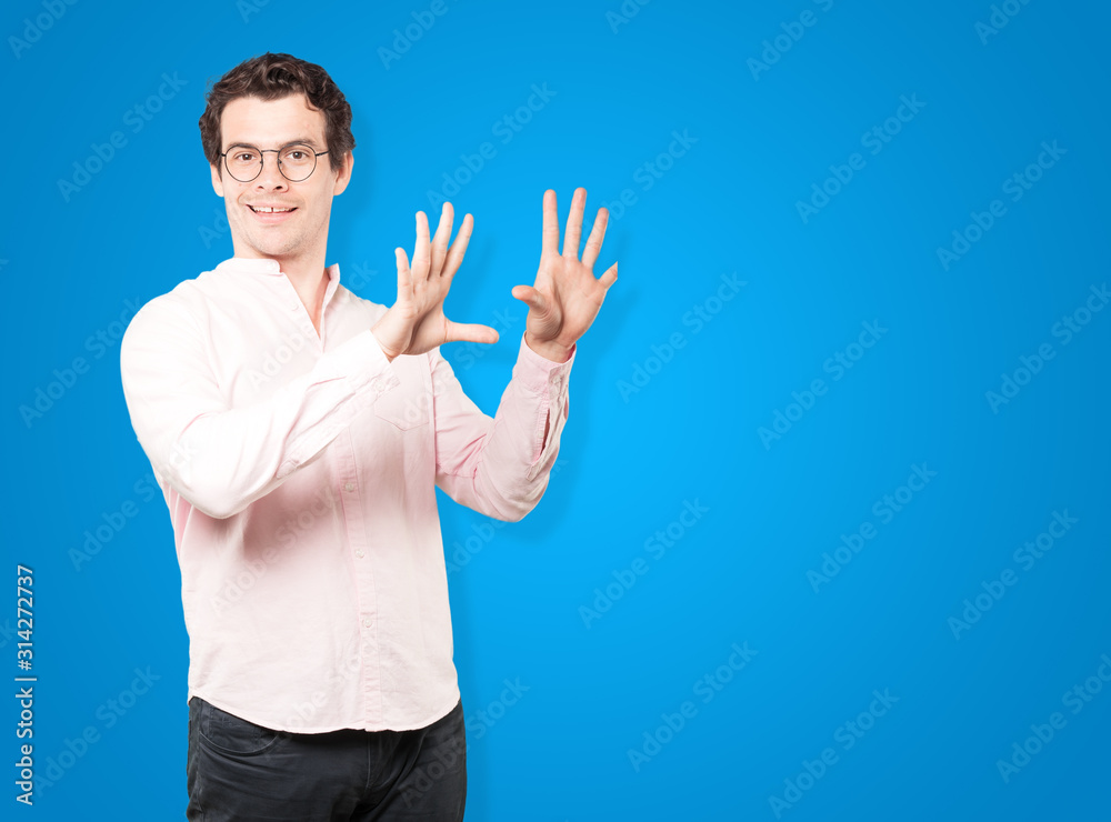 Young man making a number ten gesture Young man making a number ten gesture
