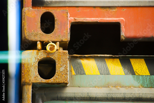 Photo of cargo container fittings secured by lashing semi automatic twist lock with pin photo