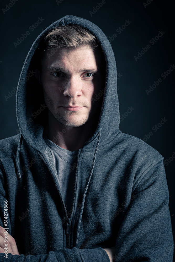 portrait of young man in hood