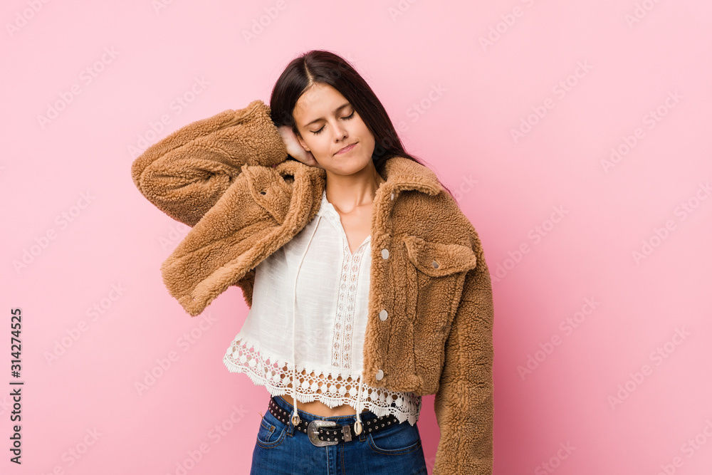Young cute woman suffering neck pain due to sedentary lifestyle. Young cute woman suffering neck pain due to sedentary lifestyle.