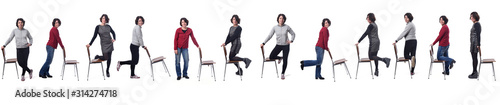 large group of woman playing with a chair in white background