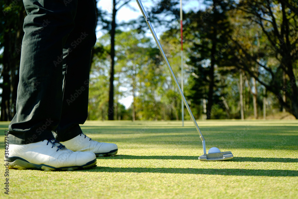 Obraz premium Golfer playing golf in beautiful golf course in the evening golf course with sunshine