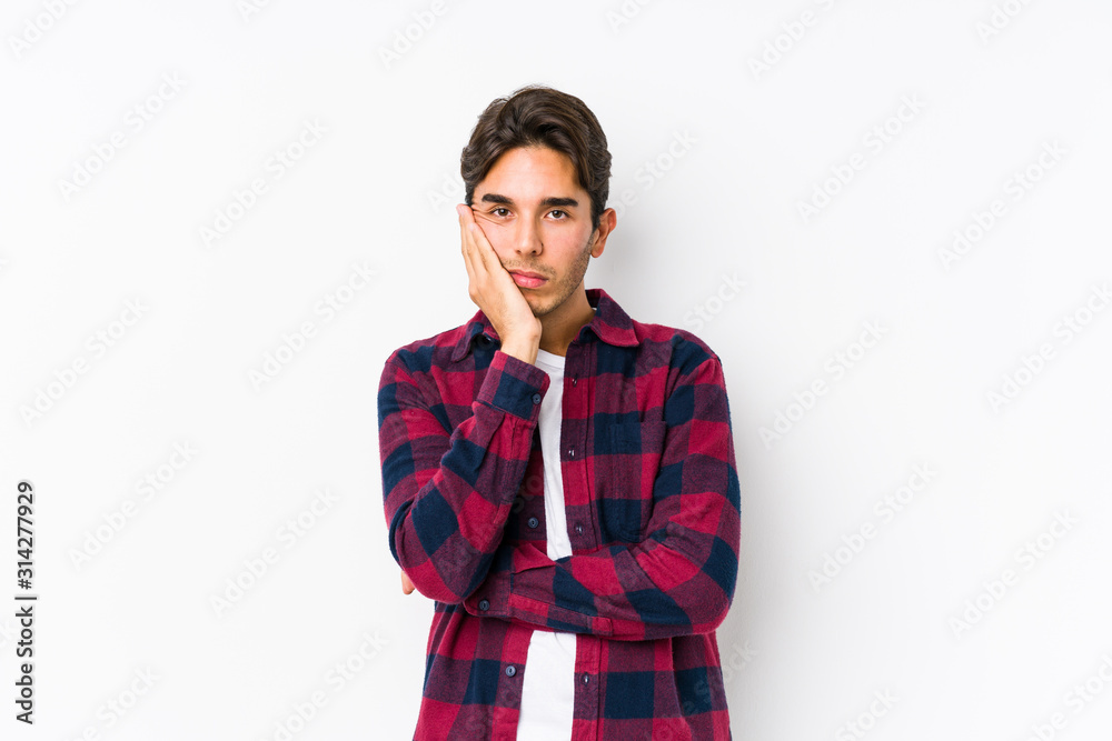 Young caucasian man posing in a pink background isolated who is bored, fatigued and need a relax day. Young caucasian man posing in a pink background isolated who is bored, fatigued and need a relax day.