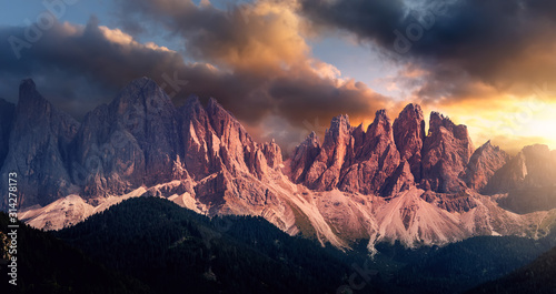 Awesome landscape with colorful sky over the Odle group or Geisler Dolomites mountains. Wonderful picturesque Scene. Fantastic View on Majestic Rocky Mountains Peaks with Dramatic sky during sunset © jenyateua