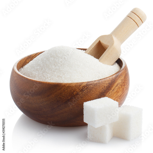 White sugar with a wooden scoop in a wooden bowl, isolated on white background
