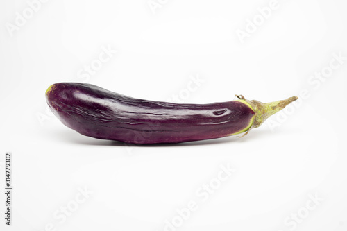 Wallpaper Mural single wrinkled purple eggplant on an isolated white background with copy space Torontodigital.ca