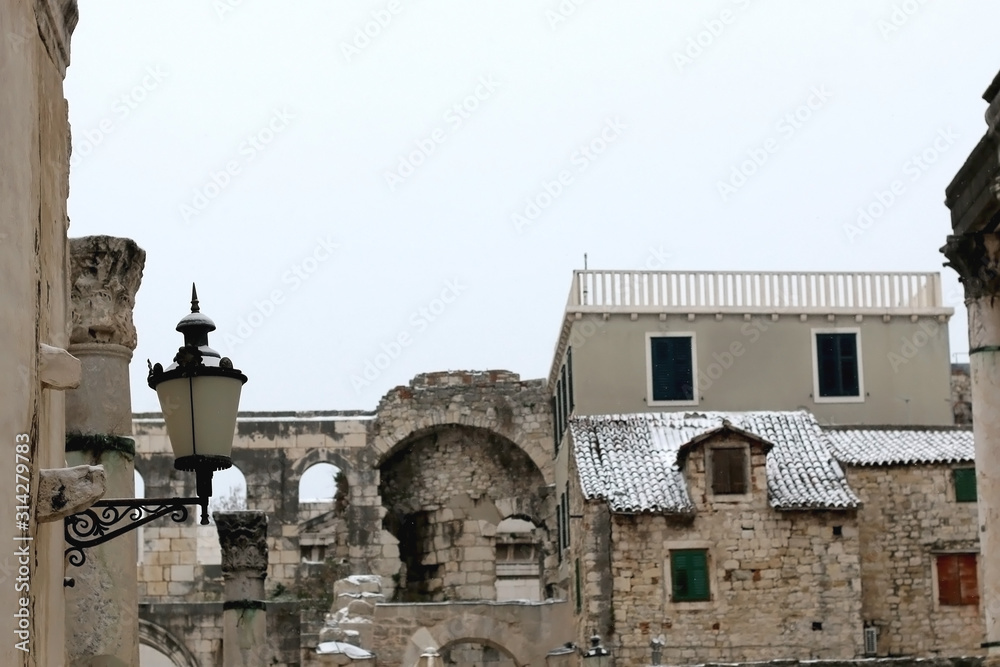 Historical and traditional architecture in Split, Croatia, covered in snow. Selective focus.