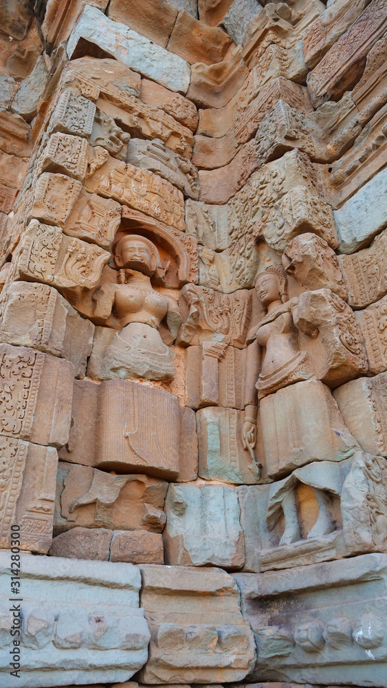Stone rock carving art ruins in Preah Ko temple in Roluos Angkor Wat complex, Siem Reap Cambodia