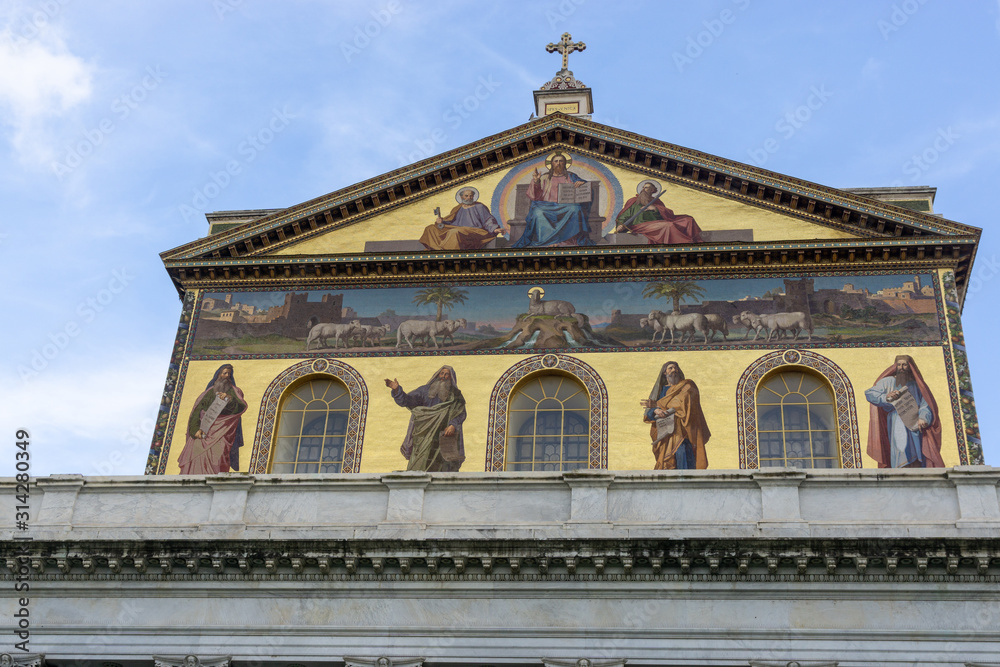 Golden dome with a roof of the Cathedral Church of the Basilica of St. Paul Fuori le Mura with the image of Jesus Christ and the Holy Apostles in Rome, Italy