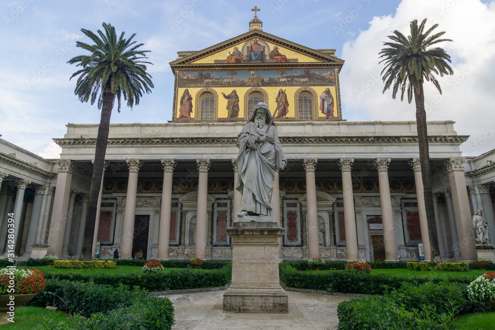 The Statue of the Apostle Paul standing in front of the Papal Basilica of Saint Paul Outside the Walls, Rome, Italy