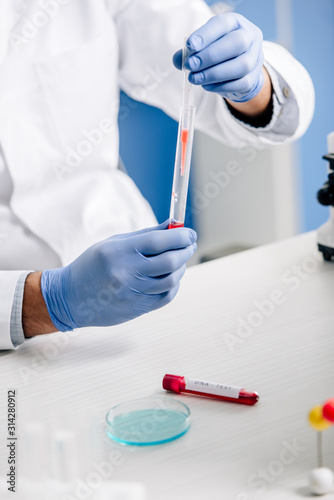 cropped view of genetic consultant doing dna test in lab
