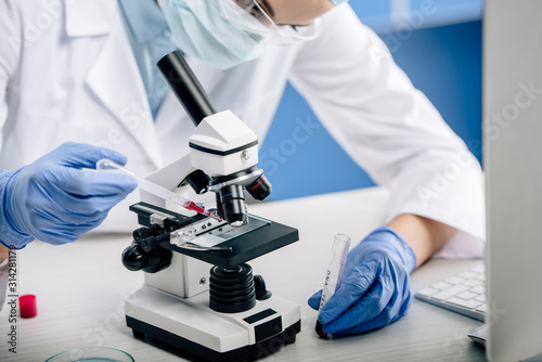 cropped view of genetic consultant doing dna test in lab