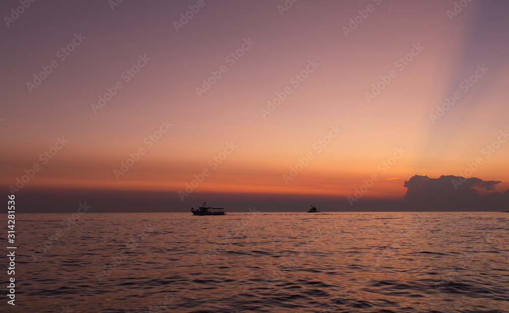 Boat. Sky. Orange. Sea. Sun. Istria